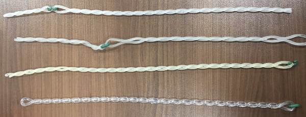 Three Worn Twisted Belts with Plastic Hooks and one New One